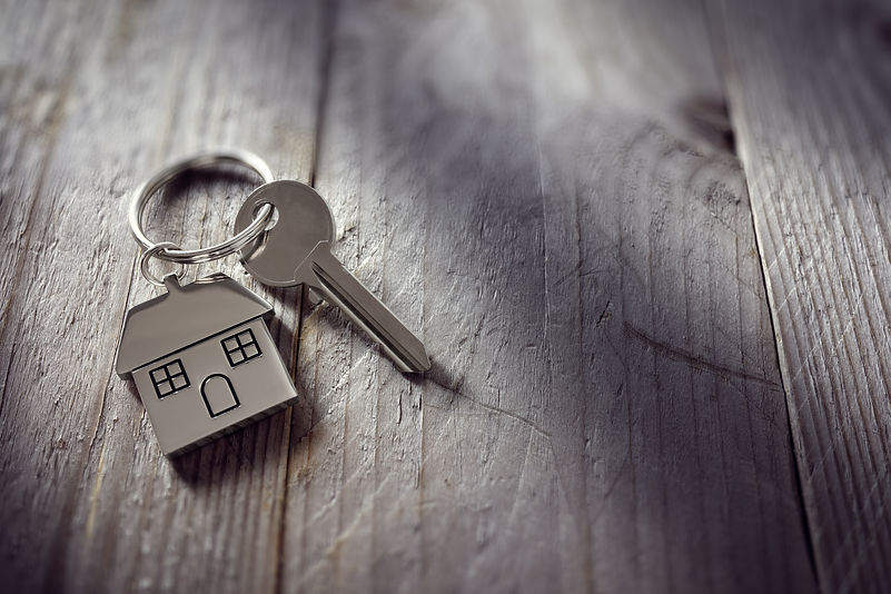 House key on a house shaped keychain res